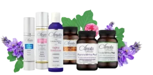 The Amata Life range: supplement bottles, moisturizer and skin care surrounded by purple flowers.